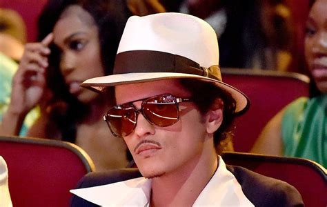 Bruno Mars is reportedly $50million in debt due to gambling .
